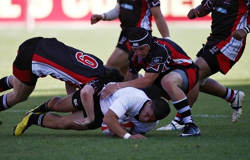 Djamila Grossman  |  The Salt Lake Tribune

Highland's Kobi Harris (10) gets tackled by several United players in the Rugby Championship game at Rio Tinto Stadium in Sandy, Utah, on Saturday, May 21, 2011. Highland won the game.