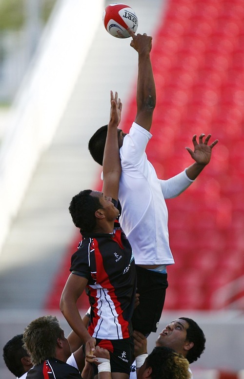 Djamila Grossman  |  The Salt Lake Tribune

Highland's  Alai Motuapuaka (5) and United's Brandon Benavides (15) try to catch the ball in the Rugby Championship game at Rio Tinto Stadium in Sandy, Utah, on Saturday, May 21, 2011. Highland won the game.