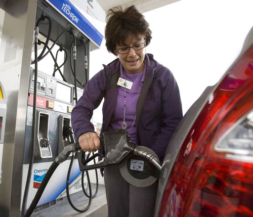Steve Griffin  |  The Salt Lake Tribune

Sue Beckett stops into Slim Olsen's Chevron in Bountiful, UT to fill up her company car Friday, May 20, 2011.