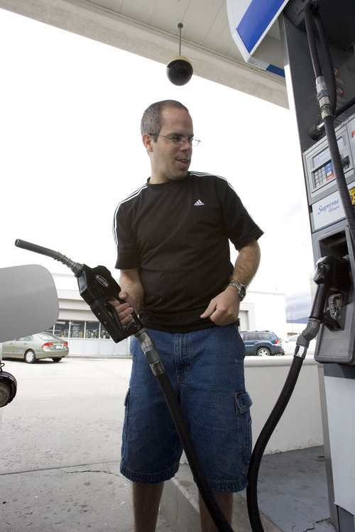 Steve Griffin  |  The Salt Lake Tribune

Nathan Probert tops off his car with gas at Slim Olsen's Chevron in Bountiful Bountiful, Utah Friday, May 20, 2011.
