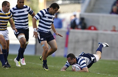 Djamila Grossman  |  The Salt Lake Tribune

Brigham Young University's Zeke Mendenhall (11) falls, as team mates Jared Whippy (12) and Villiami Vimahi (5) watch on in a game against the University of California at Berkeley in the National College Rugby Championship game at Rio Tinto Stadium in Sandy, Utah, on Saturday, May 21, 2011.  BYU lost the game.