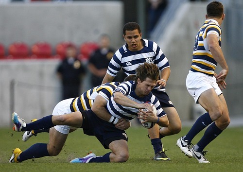 Djamila Grossman  |  The Salt Lake Tribune

harrison ball whippy Brigham Young University's Andrew Harrison (15) gets tackled by California's Seamus Kelly (13) as Jared Whippy (12) watches on in the National College Rugby Championship game at Rio Tinto Stadium in Sandy, Utah, on Saturday, May 21, 2011. BYU lost.
