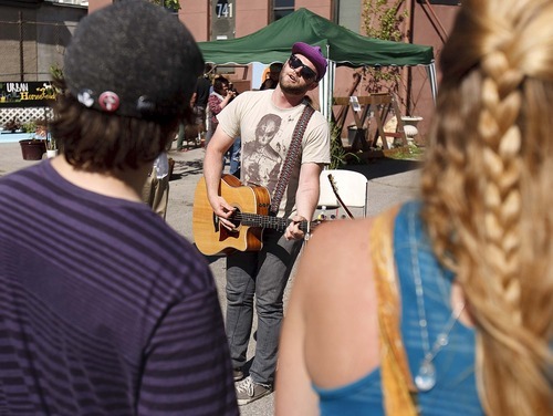 Trent Nelson  |  The Salt Lake Tribune
Jarom Bischoff belts out a song at the Granary District Block Party in Salt Lake City on Saturday.