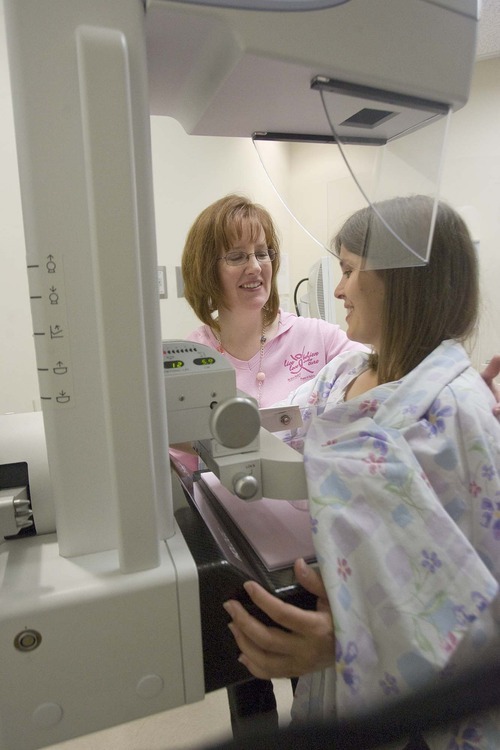 Paul Fraughton  |  The Salt Lake Tribune 
West Jordan Mayor Melissa Johnson  is positioned  by mammographer Melanie Lyons on Tuesday prior to her mammogram at Jordan Valley Medical Center's new breast care center. She agreed to  be one of the first women to  get the test at  the center to  show women  the importance  and ease of the procedure.