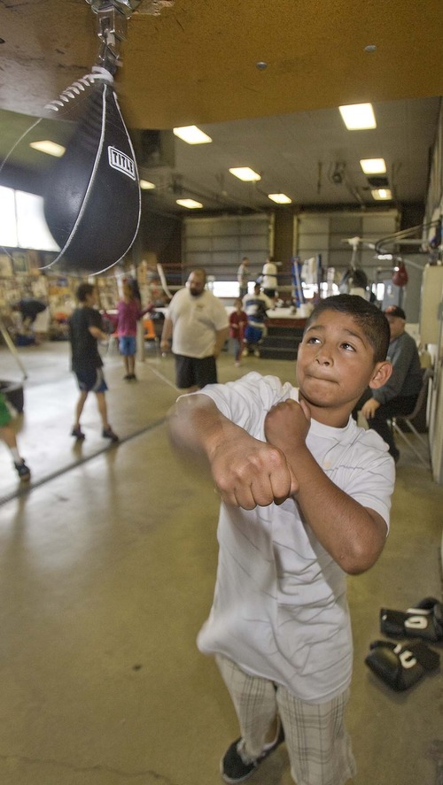 Paul Fraughton  |  The Salt Lake Tribune
Richard Cuara, age 10, works out on a speed bag at the Fullmer Brothers boxing gym in West Jordan.