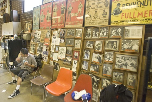 Paul Fraughton  |  The Salt Lake Tribune
Diego Barrios takes a break from his workout sitting in front of a wall of boxing history at the Fullmer Brothers Gym in West Jordan on Thursday  May 19, 2011