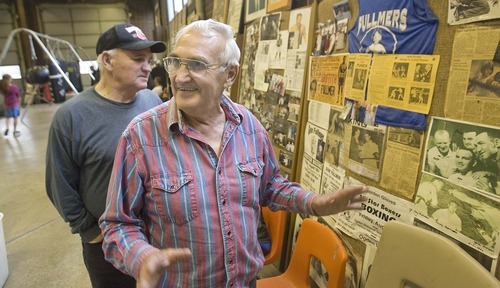 Paul Fraughton  |  The Salt Lake Tribune
Brothers Jay, front, and Don Fullmer recount boxing memories  from their careers in the ring as they look at memorabilia on display at their gym in West Jordan.