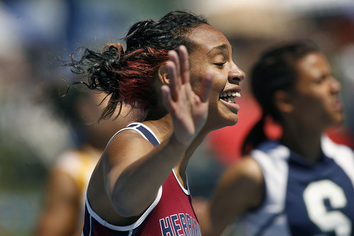 Scott Sommerdorf  |  The Salt Lake Tribune
Charis Wingster of Herriman celerates her win in the girls' 100-meter dash at the state high school track championships held at BYU on Saturday.