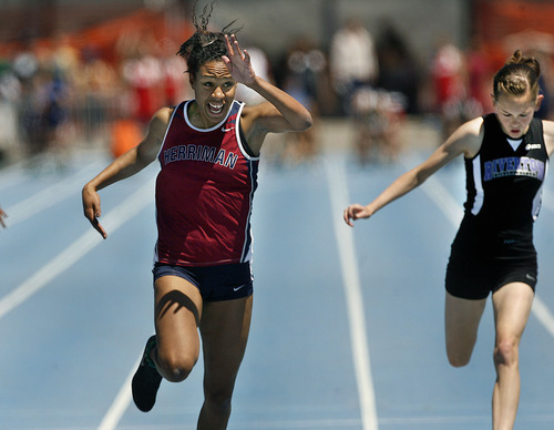 Scott Sommerdorf  |  The Salt Lake Tribune
Charis Wingster of Herriman crosses the finish line to win the girls' 100-meter dash ahead of Taylor Gomez of Riverton at the state high school track championships held at BYU on Saturday.