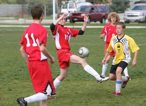 Steve Griffin  |  The Salt Lake Tribune

Legacy Academy's Kenzie Colledge kicks the ball during their game against Summit Academy in Draper, Utah Friday, May 20, 2011. Colledge filled in on the boys team because they were short some players.