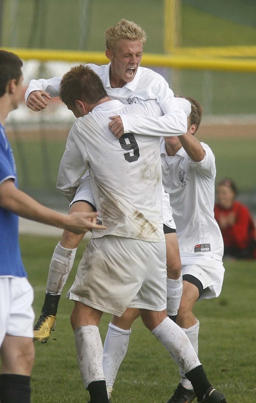 Paul Fraughton  |  The Salt Lake Tribune 
Korban Bluth of Alta celebrates his second-half goal against Bingham by jumping into the arms of teammate Derek Boggs.