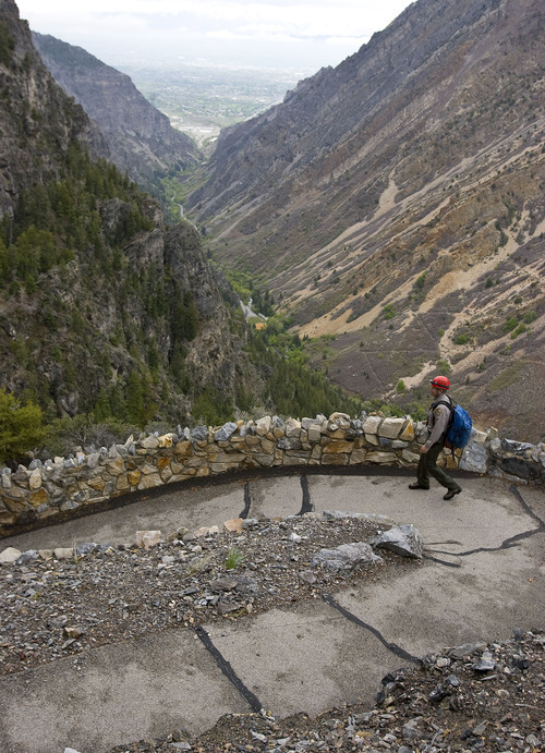 Al Hartmann  |  The Salt Lake Tribune
Denis Davis, superintendent of Timpanogos Cave National National Monument in American Fork Canyon, walks along a new stretch of rock wall built along an exposed part of the trail.   The monument has made many safety improvements along the steep 1.5-mile trail leading to the cave in several dangerous areas in the wake of recent falls over the past few years, including the death of an employee last year.  The trail improvements are to be mostly finished this week as the cave opens for the 2011 season May 27.