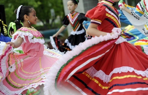 Sarah A. Miller  |  The Salt Lake Tribune

Donika Taylor, 7, of Salt Lake City, performs with the group Westside Dance at the third annual CommUNITY Fair held at the Sorenson Unity Center in Salt Lake City on Friday. The event celebrated the cultural diversity and unique community of the Glendale and Poplar Grove areas. The event also served as the kick-off for the newly created Unity Gardens, a 24-plot community garden located behind the center.