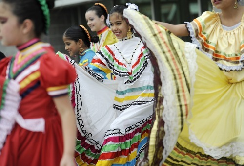 Sarah A. Miller  |  The Salt Lake Tribune

Gema Aleman, 11, of Salt Lake City, performs with the group Westside Dance at the third annual CommUNITY Fair held at the Sorenson Unity Center in Salt Lake City on Friday. he event celebrated the cultural diversity and unique community of the Glendale and Poplar Grove areas. The event also served as the kick-off for the newly created Unity Gardens, a 24-plot community garden located behind the center.