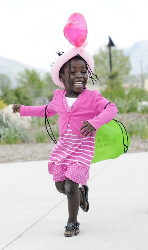 Sarah A. Miller  |  The Salt Lake Tribune

Alina Joseph, 3, of Salt Lake City, dances to music at the third annual CommUNITY Fair held at the Sorenson Unity Center in Salt Lake City on Friday. he event celebrated the cultural diversity and unique community of the Glendale and Poplar Grove areas. The event also served as the kick-off for the newly created Unity Gardens, a 24-plot community garden located behind the center.