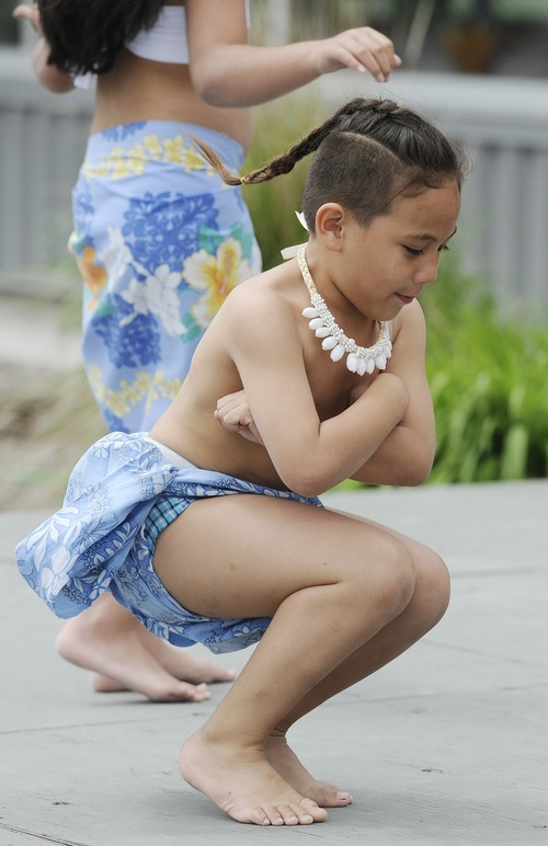 Sarah A. Miller  |  The Salt Lake Tribune

Pharaoh Hofoka, 5, of Salt Lake City, performs an oceanic dance with the group Malialoke at the third annual CommUNITY Fair held at the Sorenson Unity Center in Salt Lake City on Friday. The event celebrated the cultural diversity and unique community of the Glendale and Poplar Grove areas. The event also served as the kick-off for the newly created Unity Gardens, a 24-plot community garden located behind the center.