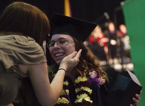 Trent Nelson  |  The Salt Lake Tribune
Diana Dani, left, congratulates Jaimee Joy Allred as she's honored with the Neisen R. Bank Memorial Award at Westminster College's Commencement Exercises at the Maverik Center in West Valley City, Utah, Saturday, May 28, 2011.