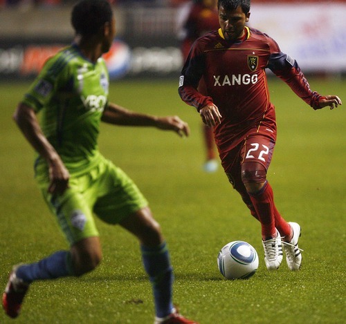 Djamila Grossman  |  The Salt Lake Tribune

Real Salt Lake plays the Seattle Sounders at Rio Tinto Stadium in Sandy, Utah, on Saturday, May 28, 2011. Real's Nelson Gonzalez (22) tries to get the ball past the Sounders' James Riley (7).