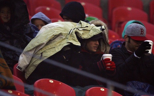 Djamila Grossman  |  The Salt Lake Tribune

Real Salt Lake plays the Seattle Sounders at Rio Tinto Stadium in Sandy, Utah, on Saturday, May 28, 2011. Fans are covered in jackets and wear gloves during rain and cold wind at the game.