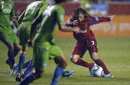 Djamila Grossman  |  The Salt Lake Tribune

Real Salt Lake plays the Seattle Sounders at Rio Tinto Stadium in Sandy, Utah, on Saturday, May 28, 2011. Real's Fabian Espindola (7) defends the ball against several Sounders players.