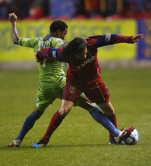 Djamila Grossman  |  The Salt Lake Tribune

Real Salt Lake plays the Seattle Sounders at Rio Tinto Stadium in Sandy, Utah, on Saturday, May 28, 2011. Real's Fabian Espindola (7) and the Sounders' James Riley (7) fight over the ball.