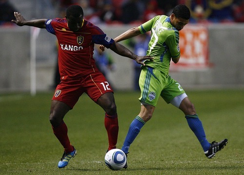 Djamila Grossman  |  The Salt Lake Tribune

Real Salt Lake plays the Seattle Sounders at Rio Tinto Stadium in Sandy, Utah, on Saturday, May 28, 2011. Real's Jean Alexandre (12) blocks the Sounders' Lamar Neagle (27) in the first half of the game.