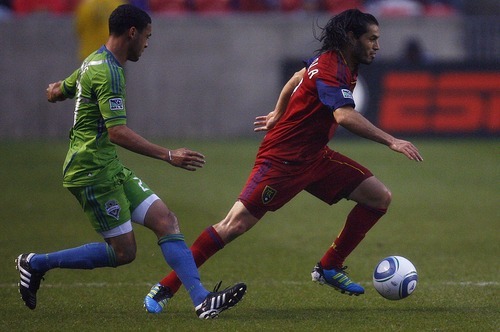 Djamila Grossman  |  The Salt Lake Tribune

Real Salt Lake plays the Seattle Sounders at Rio Tinto Stadium in Sandy, Utah, on Saturday, May 28, 2011. Real's Fabian Espindola (7) runs with the ball, followed by the Sounders' Lamar Neagle (27).