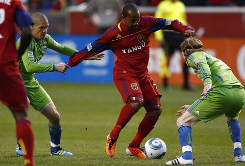 Djamila Grossman  |  The Salt Lake Tribune

Real Salt Lake plays the Seattle Sounders at Rio Tinto Stadium in Sandy, Utah, on Saturday, May 28, 2011. Real's Andy Williams (77), gets blocked by the Sounders' Erik Friberg (8) and Osvaldo Alonso (6), in the first half of the game.