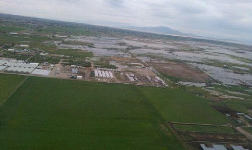 Photo courtesy Lance Peterson  /  Weber County Emergency Management

An area view shows flood water from the Weber River encroaching on Pineae Greenhouse, the largest greenhouse in the state.