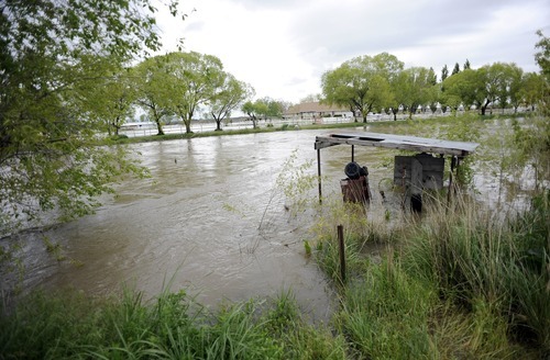 Sarah A. Miller  |  The Salt Lake Tribune

Water flooding out from the Weber River fills the front yard of a home on W 1600 South outside of Ogden Sunday, May 29, 2011.