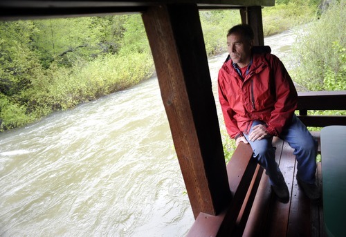 Sarah A. Miller  |  The Salt Lake Tribune

Keith Rounkles, owner of The Oaks restaurant in Ogden Canyon, sits on the deck at his business where water from the Ogden River has been rising Sunday, May 29, 2011. 
