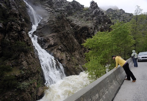 Sarah A. Miller  |  The Salt Lake Tribune

People stop to watch the water flowing from this manmade waterfall near the mouth of Ogden Canyon. It pours down water from an overflow pipe coming from the Pineview Reservoir Dam Sunday, May 29, 2011.