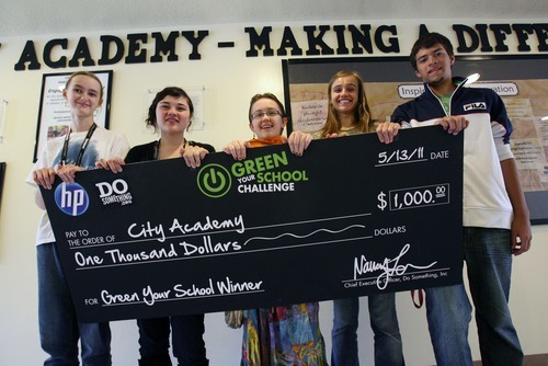 Steve Griffin  |  The Salt Lake Tribune
City Academy students Lorna Fullmer, Phoebe Stokes, Shivone McMullin, Nikole Pruess and Alex Martinson hold a giant check the school won as part of the Green School Challenge.