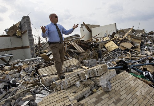 Djamila Grossman  |  The Salt Lake Tribune

Joplin LDS Bishop Dave Richins stands on the rubble of the Joplin Second Ward of The Church of Jesus Christ of Latter-Day Saints in Joplin, Missouri, on Wednesday, June 1, 2011. The stake center was destroyed but Richins is confident his ward will recover.