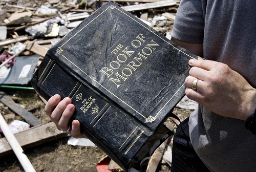 Djamila Grossman  |  The Salt Lake Tribune

Adam Wright holds a Book of Mormon he found after it was damaged in the recent tornado that tore through Joplin, Missouri, and destroyed his home, on Wednesday, June 1, 2011. Wright is a member of the Church of Jesus Christ of Latter-Day Saints.