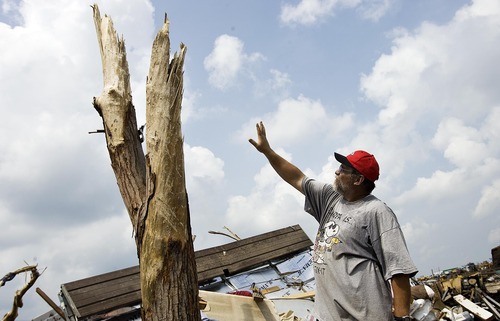 Djamila Grossman  |  The Salt Lake Tribune

Tim Bartow points at a tree on his property that was badly damaged in the recent tornado in Joplin, Missouri, on Wednesday, June 1, 2011. The family's home also was destroyed.