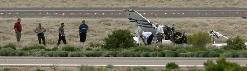 Steve Griffin  |  The Salt Lake Tribune
Officials look through the wreckage of a plane that crashed at the Wendover Airport in Wendover on Wednesday, killing four people. The Cessna 172 single-engine, fixed wing aircraft crashed between two runways.