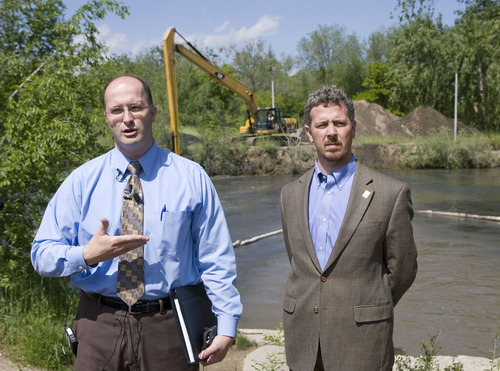 Al Hartmann  |  The Salt Lake Tribune
Scott Baird, Salt Lake County's director of flood control, left, and Patrick Leary, director of Salt Lake Public Works, hold a press conference on the shore of the Jordan RIver near 1300 South and 900 West on Thursday to explain the county's preparations for the late spring runoff.