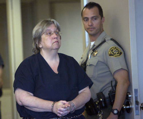Al Hartmann  |  The Salt Lake Tribune
Sherrie Beckering, charged with aggravated abuse of a disabled adult for the March death of 22-year-old Christina Harms, arrives in the 3rd District Court in Salt Lake City on Friday for a preliminary hearing.