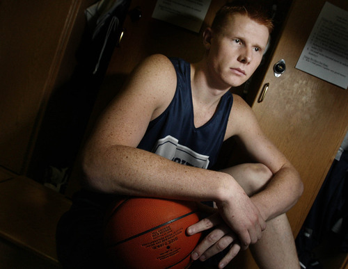 Utah State University basketball player Gary Wilkinson once was headed into trouble as a youth, dropping out of high school, but has become an exemplary student-athlete at USU.  Wilkinson carries an old driver's license as a reminder of his past.
Photo by Leah Hogsten/ The Salt Lake Tribune
Logan 3/6/09
