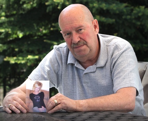 Rick Egan  |  The Salt Lake Tribune
Mike Jensen holds a photo of his daughter, Jessica Jensen, on Friday. Jessica Jensen was found dead under a mattress at the Capitol Motel, 1749 S. State, on Wednesday.