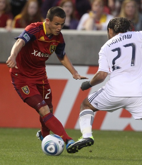 Rick Egan   |  The Salt Lake Tribune
Luis Gil controls the ball as Vancouver's Alexandre Morfaw defends in MLS action on June 4.