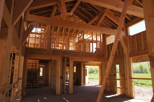 Kim McDaniel | The Salt Lake Tribune
The great room, looking back toward the center of the house and the second floor. The room behind the entry could be a kitchen, though little plumbing is done yet if it is.