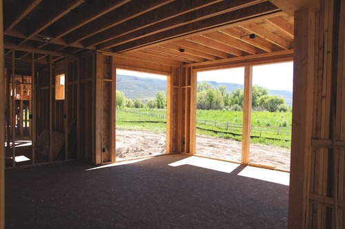 Kim McDaniel | The Salt Lake Tribune
Room behind the entry, with floor to ceiling windows across the full back and both sides of the back half of the room, overlooking the river.