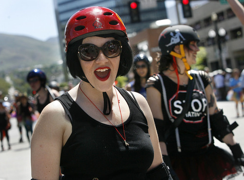 Scott Sommerdorf  |  The Salt Lake Tribune
Derby Girls skate as the Utah Pride parade heads down 200 South, Sunday, June 5, 2011.