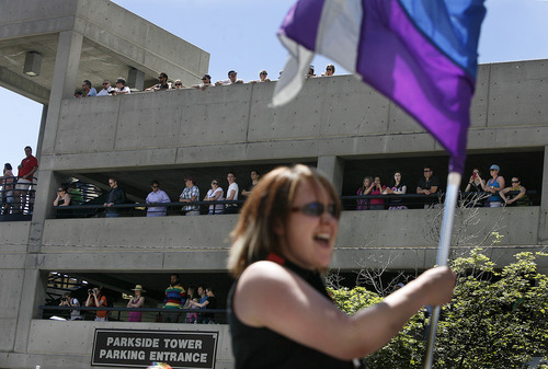 Scott Sommerdorf  |  The Salt Lake Tribune
People watch from the Parkside Tower parking garage as the Utah Pride parade heads down 200 South, Sunday, June 5, 2011.