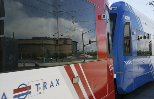 Francisco Kjolseth  |  The Salt Lake Tribune
The Maverik Center is reflected in a TRAX train being tested by operators of the new West Valley City spur. The new line is open for testing only, and officials urge extra caution as the testing intensifies. The new line is scheduled to open on Aug. 7.