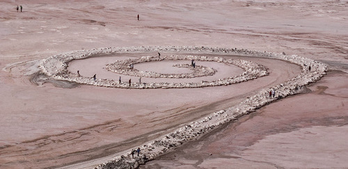 Tribune file photo 
Visitors walk along the Spiral Jetty on the Great Salt Lake in 2004.