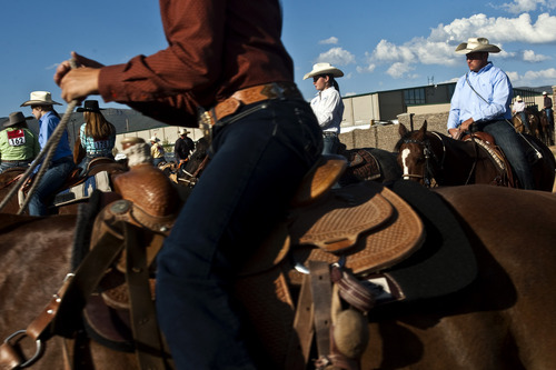 Chris Detrick  |  The Salt Lake Tribune 
Cowboys and cowgirls warm up before the Utah High School Finals Rodeo at the Wasatch County Special Event Center on Friday.