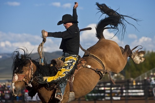 Photo by Chris Detrick | The Salt Lake Tribune 
Coburn Bradshaw rides Dandylion during the saddle bronc competition during the Utah High School Finals Rodeo at the Wasatch County Special Event Center Friday June 10, 2011.  Bradshaw scored a 77.
